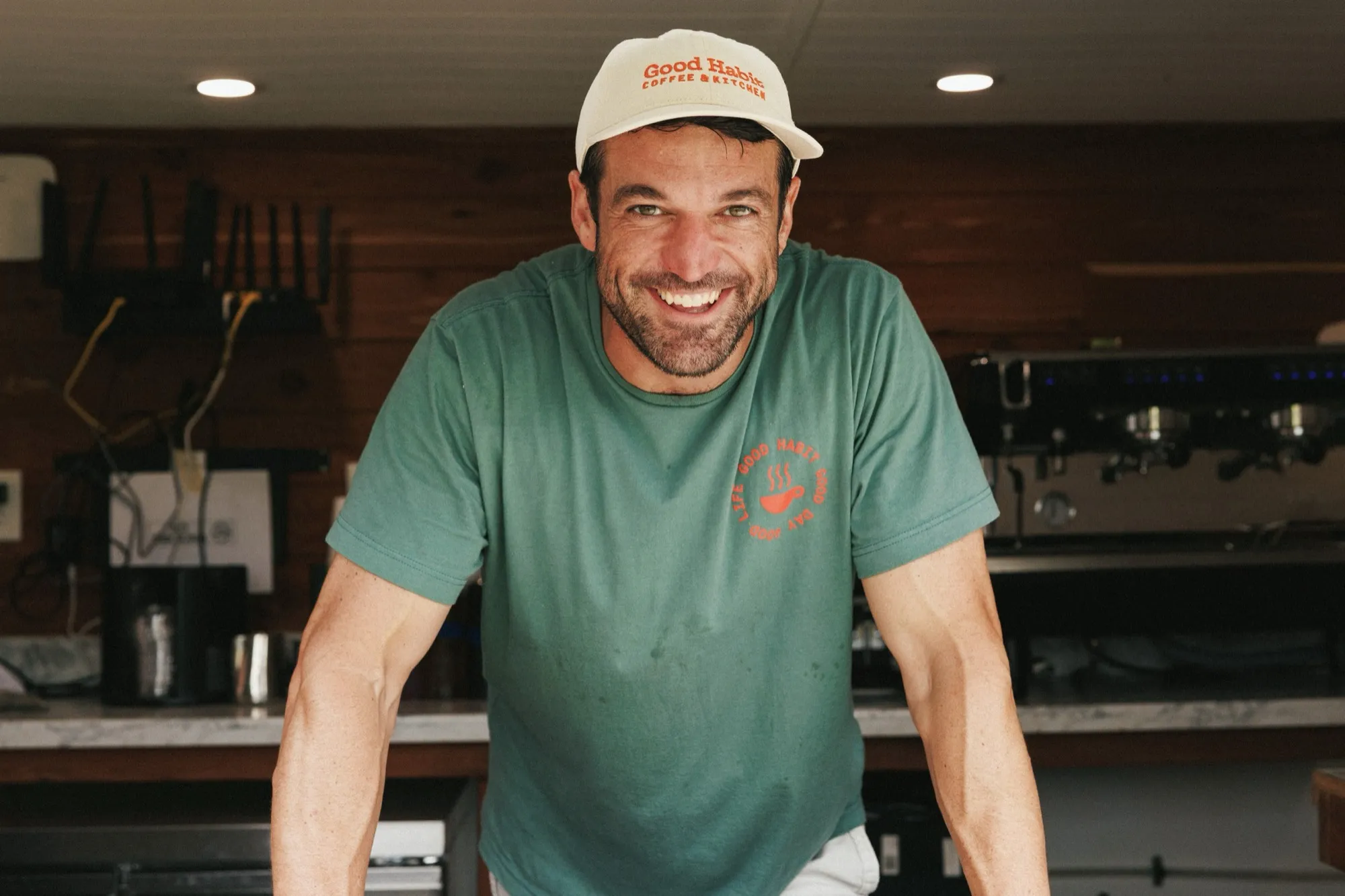 A Good Habit barista smiling behind the espresso bar